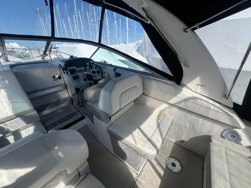 Slide: The Image of Interior of 2020 Regal 26 XO boat with white seating and modern dashboard. - 16