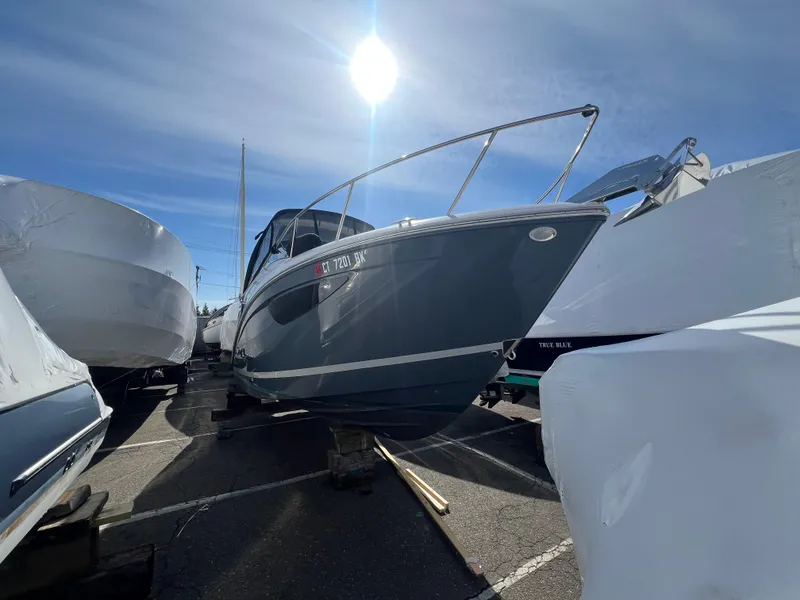 Slide: The Image of 2020 Regal 26 XO boat on dry dock under bright sun. - 3