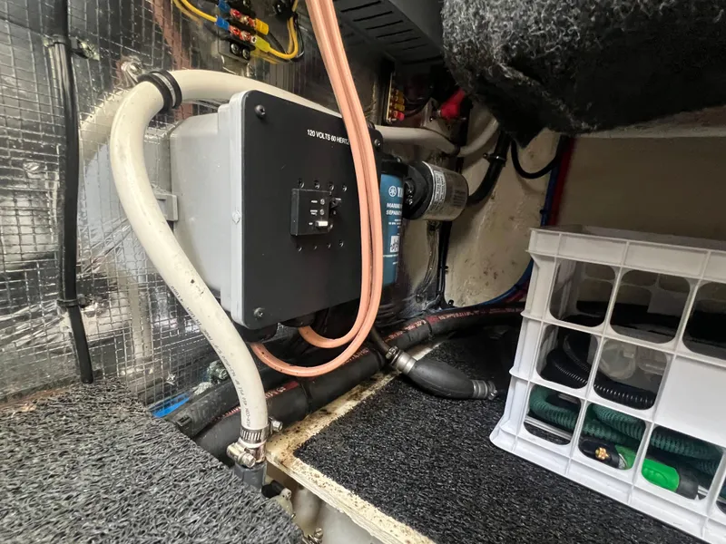 Slide: The Image of Engine compartment of 2020 Regal 26 XO boat with wiring and storage crate. - 32