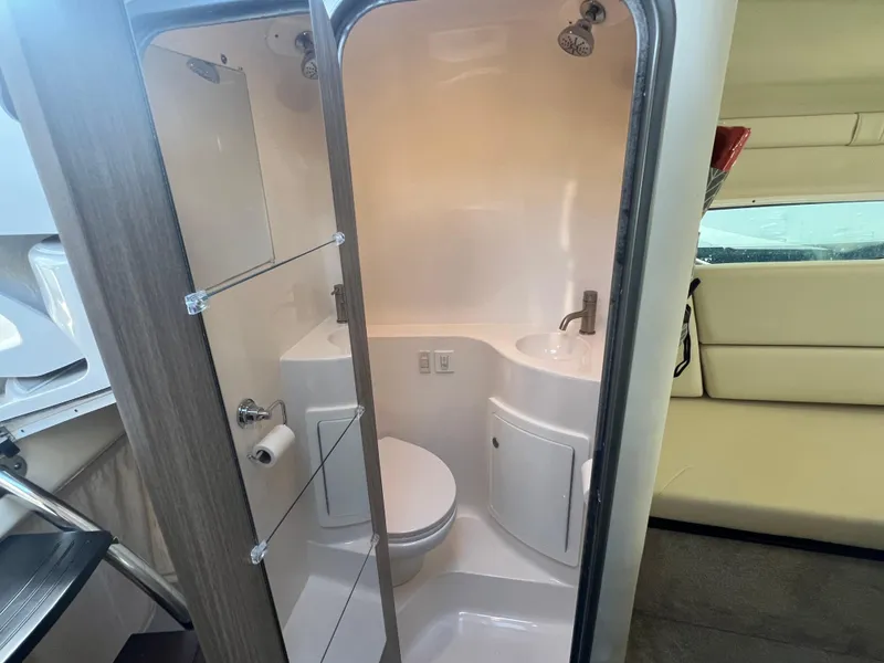 Slide: The Image of 2020 Regal 26 XO boat bathroom with shower, sink, and toilet. - 39