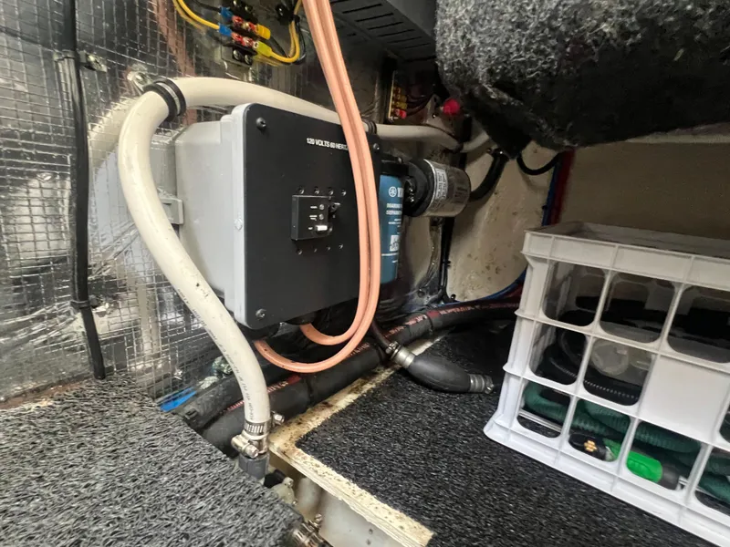 Slide: The Image of Engine compartment of a 2020 Regal 26 XO boat, featuring wiring and storage. - 41