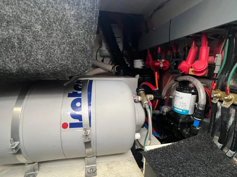 Slide: The Image of Engine compartment of a 2020 Regal 26 XO boat, featuring Isotemp water heater. - 42