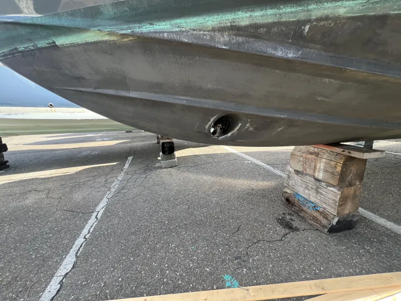 Slide: The Image of Bottom view of a 2020 Regal 26 XO boat on wooden blocks. - 5