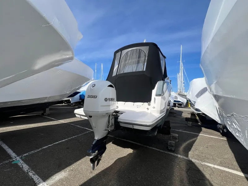 Slide: The Image of 2020 Regal 26 XO boat with Yamaha 300 engine, docked outdoors. - 7