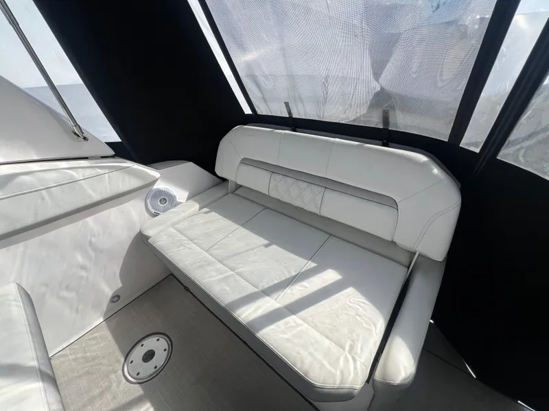 Slide: The Image of 2020 Regal 26 XO boat interior with white seating and modern design. - 9