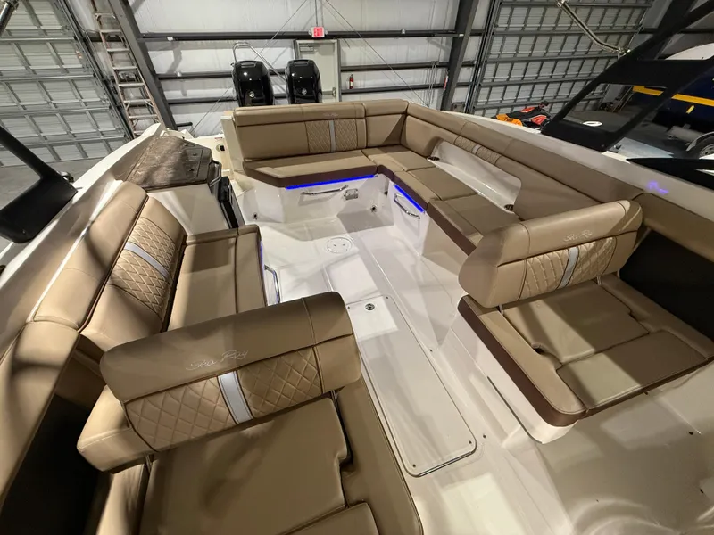 Slide: The Image of 2016 Sea Ray 290 Sundeck Outboard with spacious seating and modern interior design. - 19