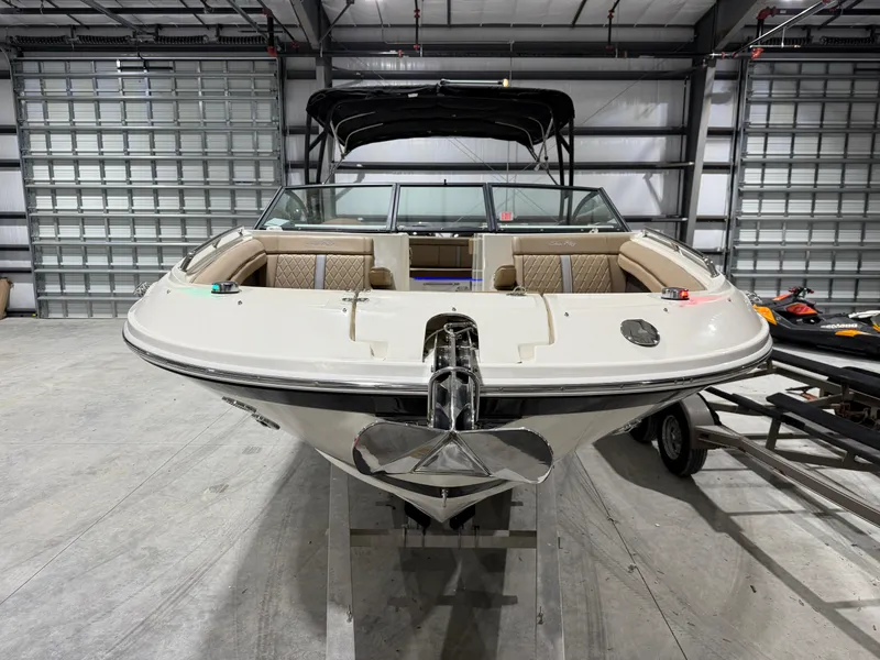Slide: The Image of 2016 Sea Ray 290 Sundeck Outboard boat in storage, front view. - 3