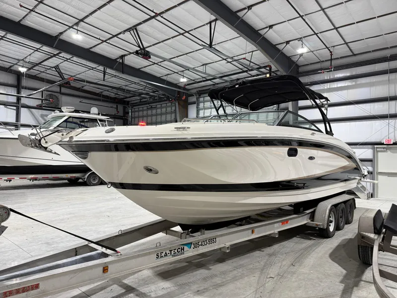 Slide: The Image of 2016 Sea Ray 290 Sundeck Outboard on trailer in indoor storage facility. - 6