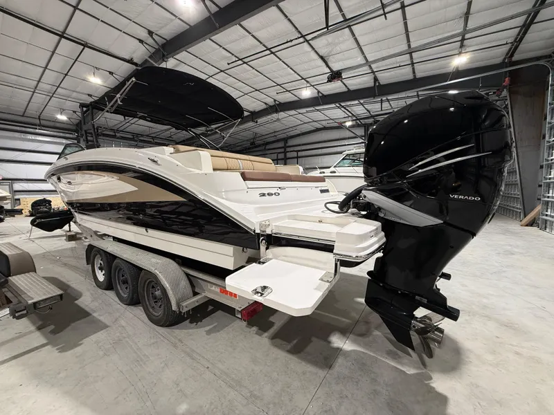 Slide: The Image of 2016 Sea Ray SDX 290 Outboard boat in a warehouse, featuring dual engines. - 3