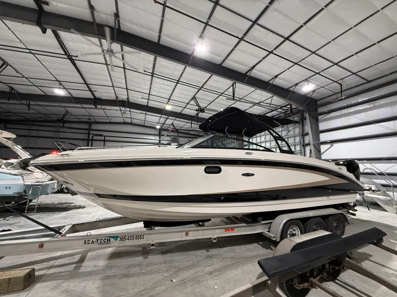 Slide: The Image of 2016 Sea Ray SDX 290 Outboard boat on trailer in indoor storage facility. - 5
