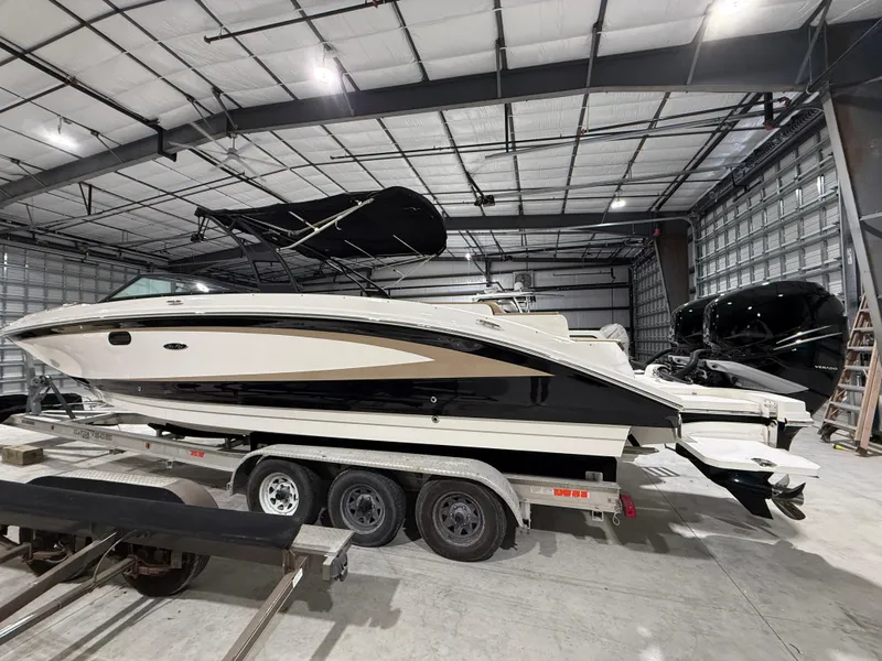 Slide: The Image of 2016 Sea Ray SDX 290 Outboard boat on trailer in indoor storage facility. - 6