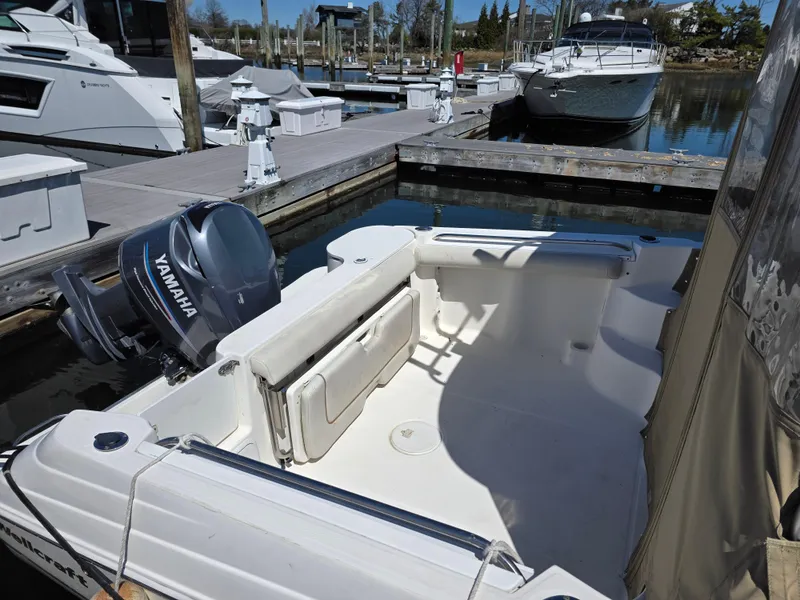 Slide: The Image of 2004 Wellcraft 252 Coastal boat docked with Yamaha outboard motor. - 9