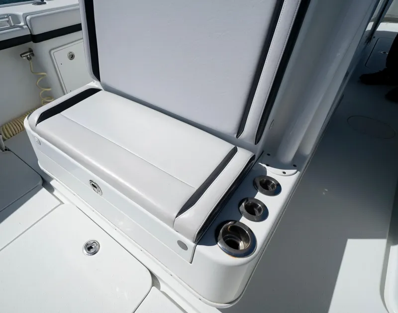 Slide: The Image of 2018 Yellowfin 32 Offshore boat seat with cup holders. - 11