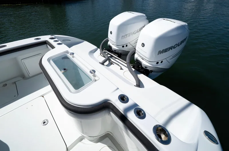 Slide: The Image of 2018 Yellowfin 32 Offshore boat with dual Mercury outboard engines on calm water. - 15