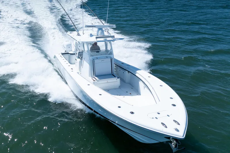 Slide: The Image of 2018 Yellowfin 32 Offshore boat cruising on open water, showcasing sleek design and performance. - 17