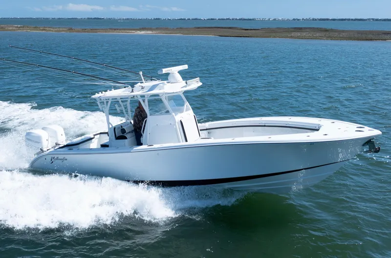 Slide: The Image of 2018 Yellowfin 32 Offshore boat cruising on open water. - 18