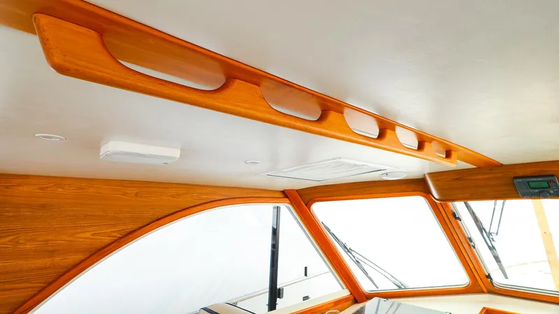 Slide: The Image of Interior view of 2009 Legacy 32 boat, featuring wooden trim and modern design elements. - 15