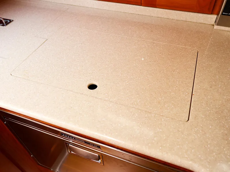 Slide: The Image of 2009 Legacy 32 yacht kitchen countertop with integrated sink cover. - 18