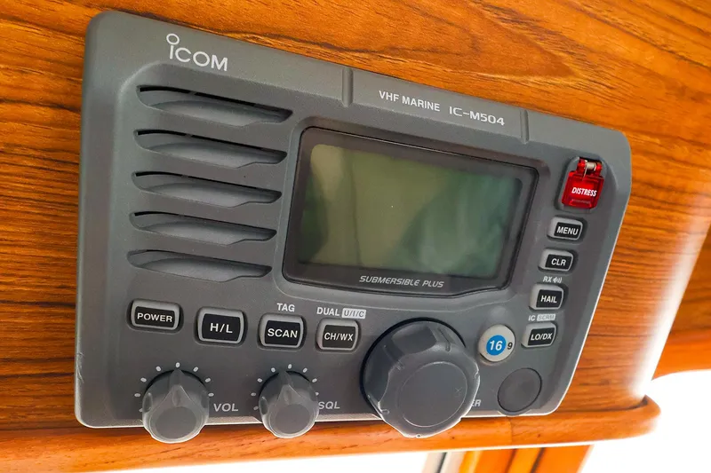 Slide: The Image of Icom VHF Marine IC-M504 radio on Legacy 32, 2009 model, mounted on wooden panel. - 31