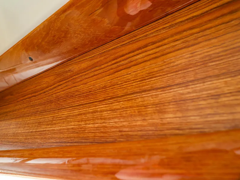 Slide: The Image of Polished wooden surface detail from a 2009 Legacy 32 model. - 32