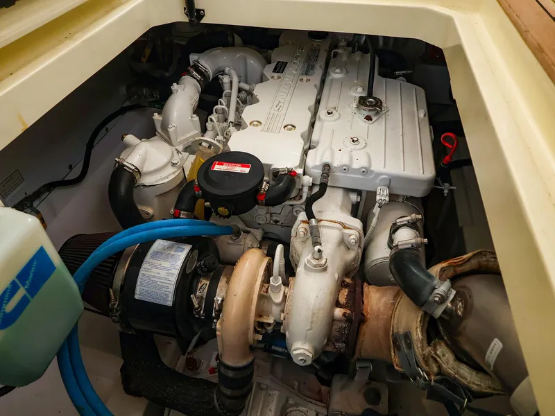 Slide: The Image of Engine compartment of a 2009 Legacy 32 boat, showcasing detailed mechanical components. - 36