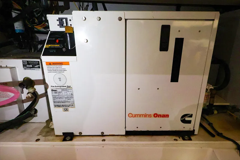 Slide: The Image of Cummins Onan generator in a Legacy 32, 2009 model, installed in an engine compartment. - 38