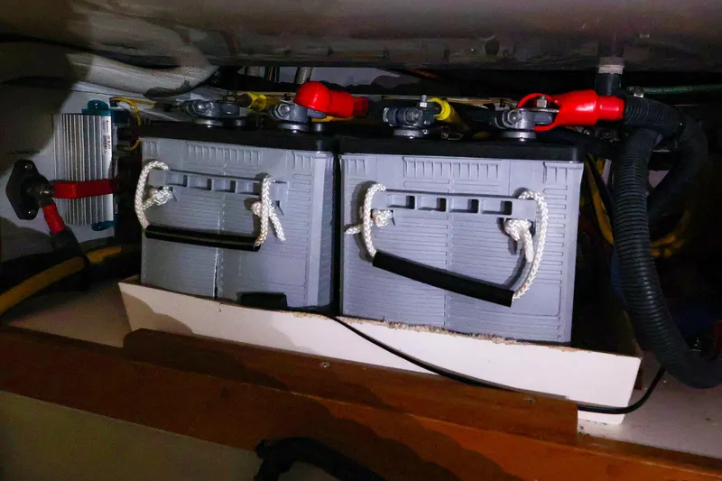 Slide: The Image of Two marine batteries with cables in a Legacy 32 boat, 2009 model. - 40