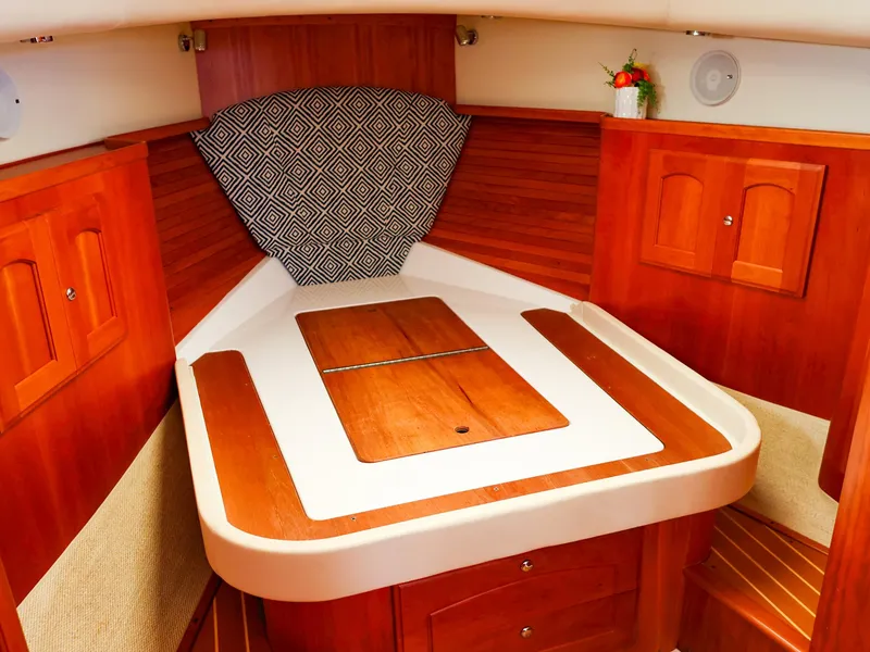 Slide: The Image of Luxurious cabin interior of 2009 Legacy 32 boat with wooden finish and geometric decor. - 42