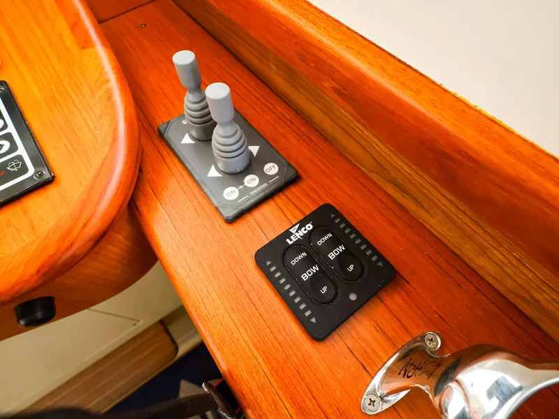 Slide: The Image of Control panel on a 2009 Legacy 32 boat with joystick and Lenco trim tab controls. - 6