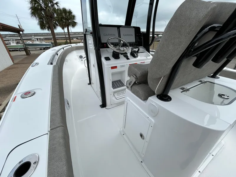 Slide: The Image of 2025 Sea Hunt Gamefish 27 boat interior with helm and seating. - 12