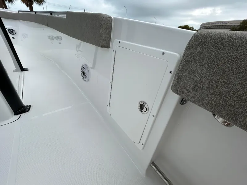 Slide: The Image of 2025 Sea Hunt Gamefish 27 boat interior with coffin box, featuring sleek design and cushioned seating. - 18