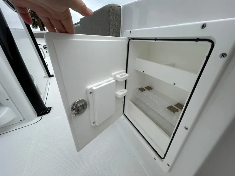 Slide: The Image of Open storage compartment on 2025 Sea Hunt Gamefish 27 boat. - 19