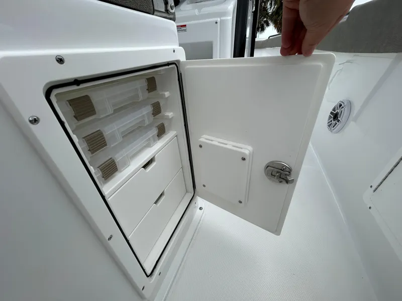 Slide: The Image of Storage compartment on 2025 Sea Hunt Gamefish 27 boat with organized tackle boxes. - 20