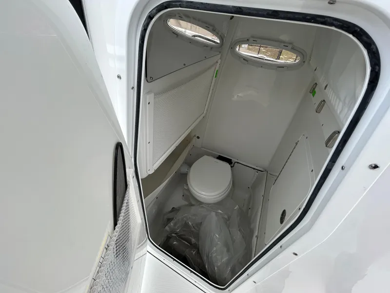 Slide: The Image of Interior view of 2025 Sea Hunt Gamefish 27 boat's compact bathroom. - 22