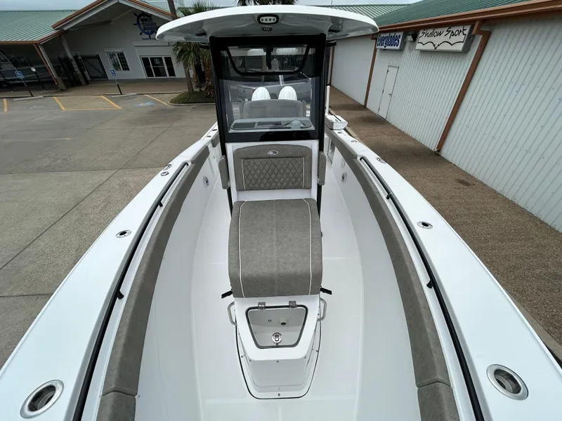 Slide: The Image of 2025 Sea Hunt Gamefish 27 with Coffin Box, featuring sleek design and spacious seating. - 23