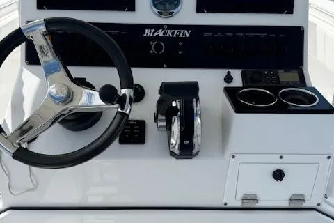 Slide: The Image of 2019 Blackfin 221 CC boat dashboard with steering wheel and controls. - 3