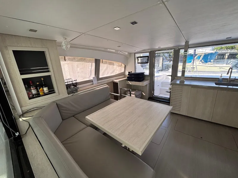 Slide: The Image of Modern interior of 2019 Leopard 40 catamaran with dining area and kitchenette. - 1
