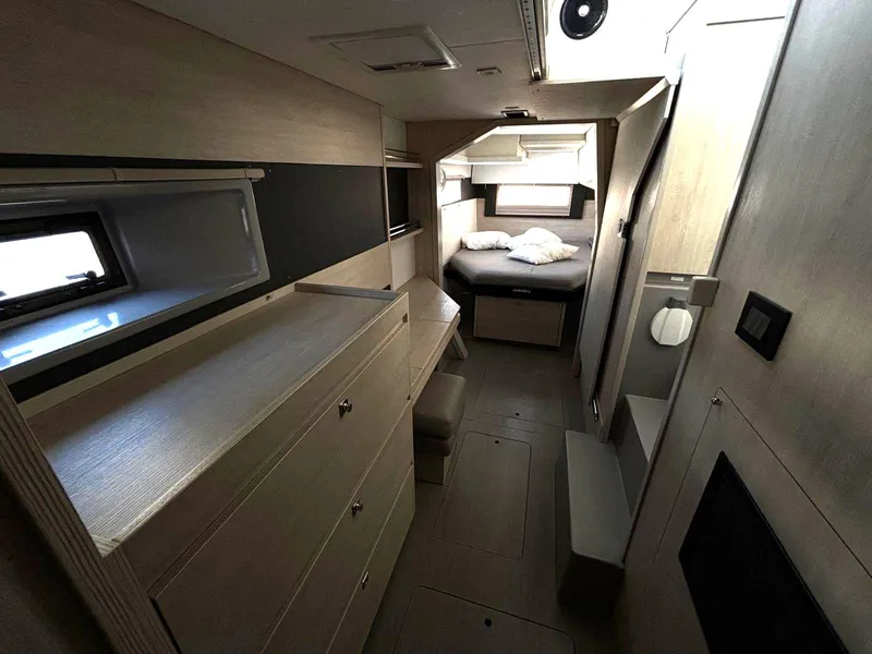 Slide: The Image of 2019 Leopard 40 yacht interior with modern cabin, bed, and storage. - 12