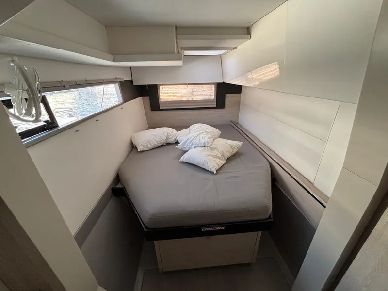 Slide: The Image of Cozy bedroom in 2019 Leopard 40 catamaran with modern design and comfortable bedding. - 13