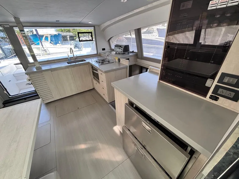 Slide: The Image of Modern kitchen interior of 2019 Leopard 40 catamaran with sleek design and ample natural light. - 2