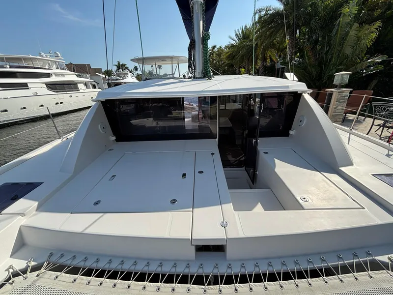 Slide: The Image of 2019 Leopard 40 catamaran docked, featuring spacious deck and modern design. - 22