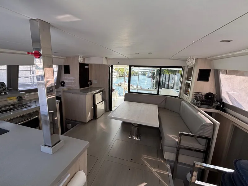 Slide: The Image of Interior of 2019 Leopard 40 catamaran with modern seating and dining area. - 23