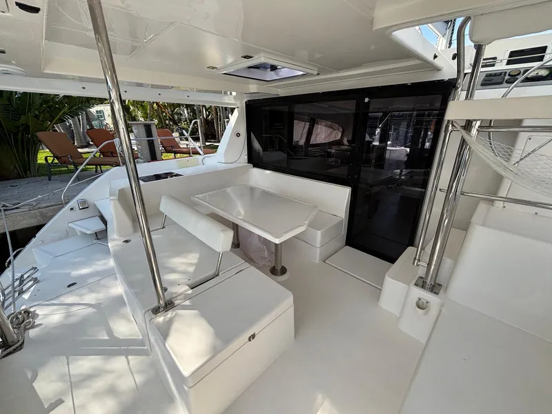 Slide: The Image of 2019 Leopard 40 yacht cockpit with white seating and table, modern design. - 26