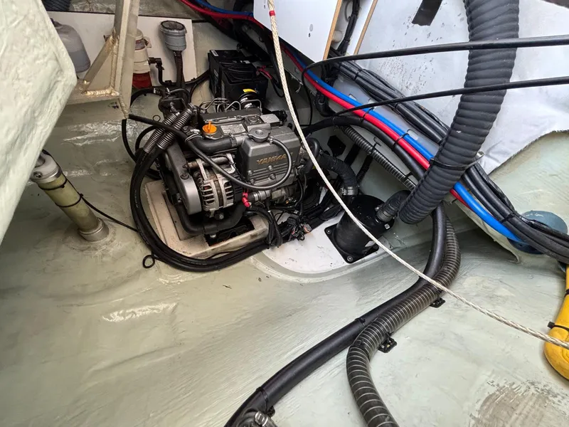 Slide: The Image of Engine compartment of a 2019 Leopard 40 catamaran, showcasing wiring and mechanical components. - 28
