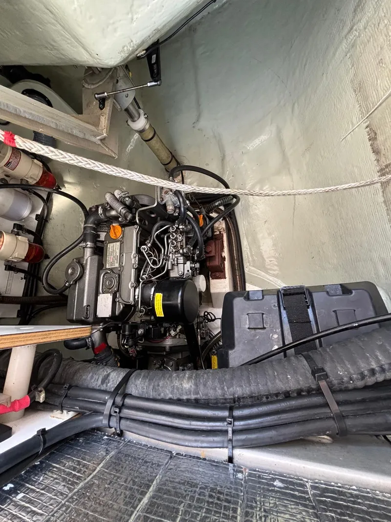 Slide: The Image of Engine compartment of a 2019 Leopard 40 catamaran, showcasing mechanical components and wiring. - 30