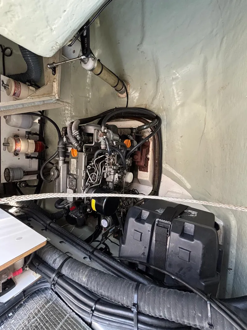 Slide: The Image of Engine compartment of a 2019 Leopard 40 catamaran, showcasing mechanical components and wiring. - 31