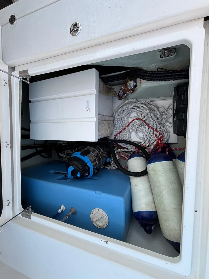 Slide: The Image of Storage compartment of a 2019 Leopard 40 boat with ropes and equipment. - 33