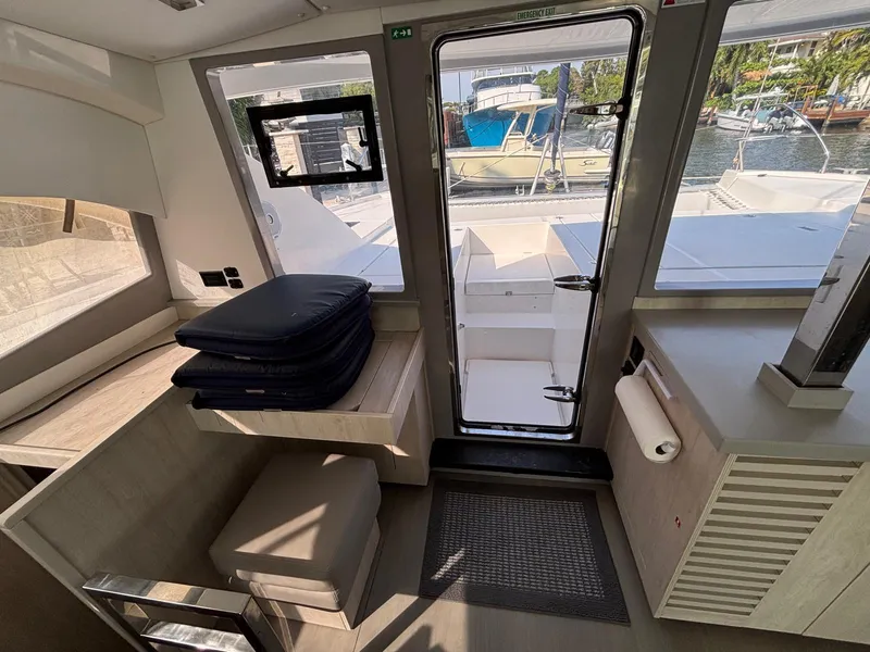 Slide: The Image of Interior of 2019 Leopard 40 yacht with seating, door, and marina view. - 5
