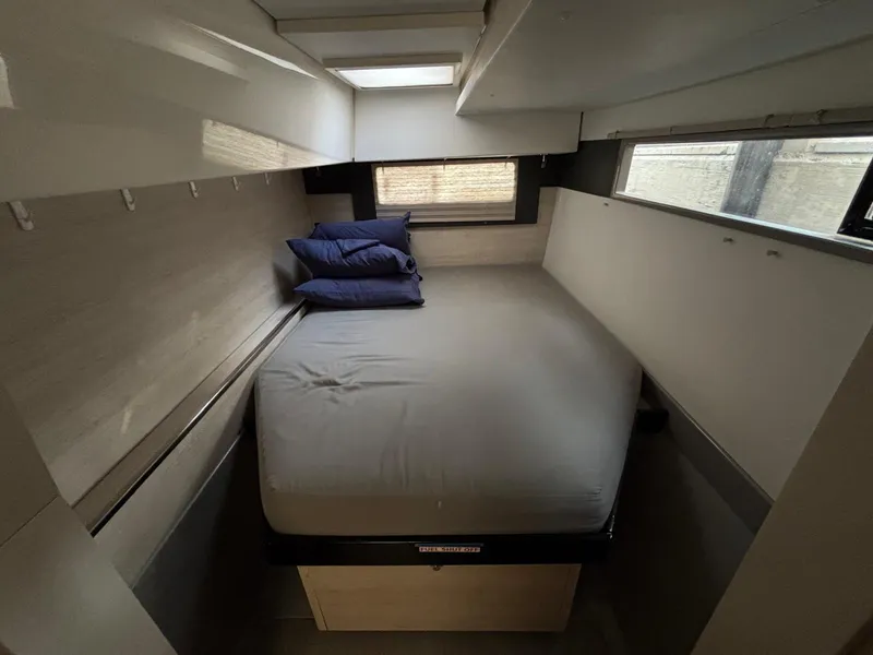 Slide: The Image of Cozy bedroom in 2019 Leopard 40 catamaran with skylight and pillows. - 8