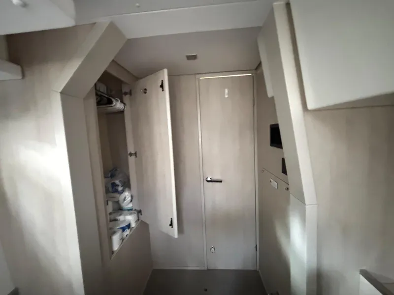 Slide: The Image of Interior of a 2019 Leopard 40 yacht, featuring a storage cabinet and modern design. - 9